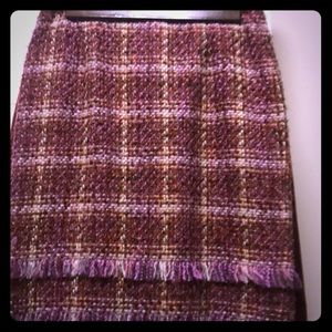 Fringed plaid skirt.